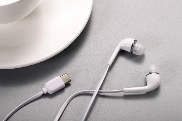 Headphones in half? Or in the ear?
