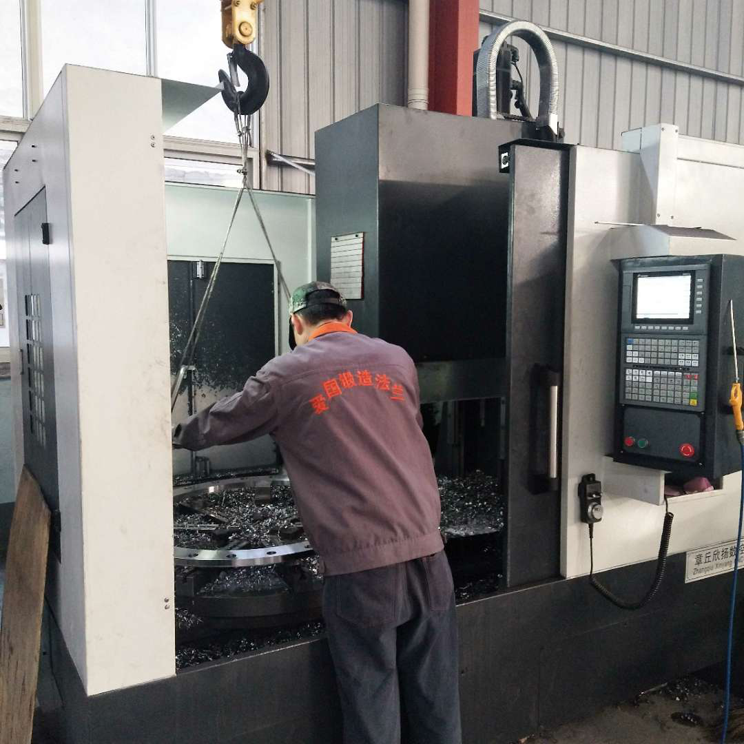 Technical workers complete the process on CNC flanges