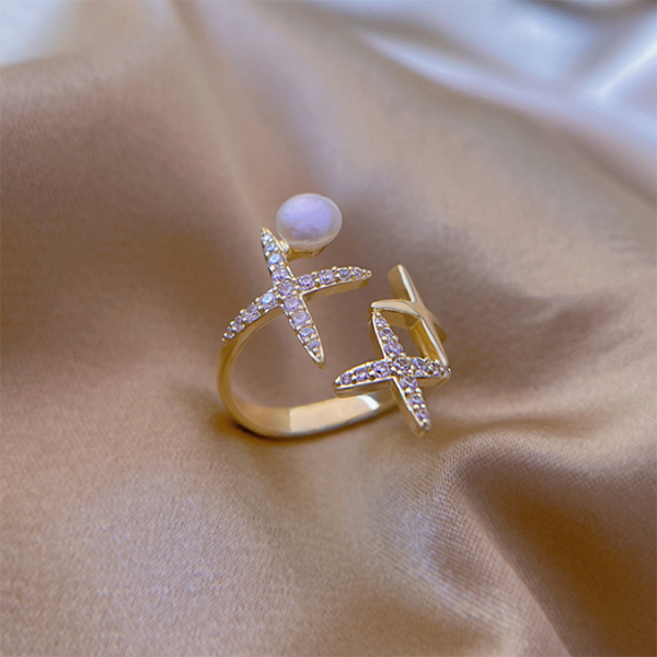 Ring With Pearls In The Shape Of A Cross