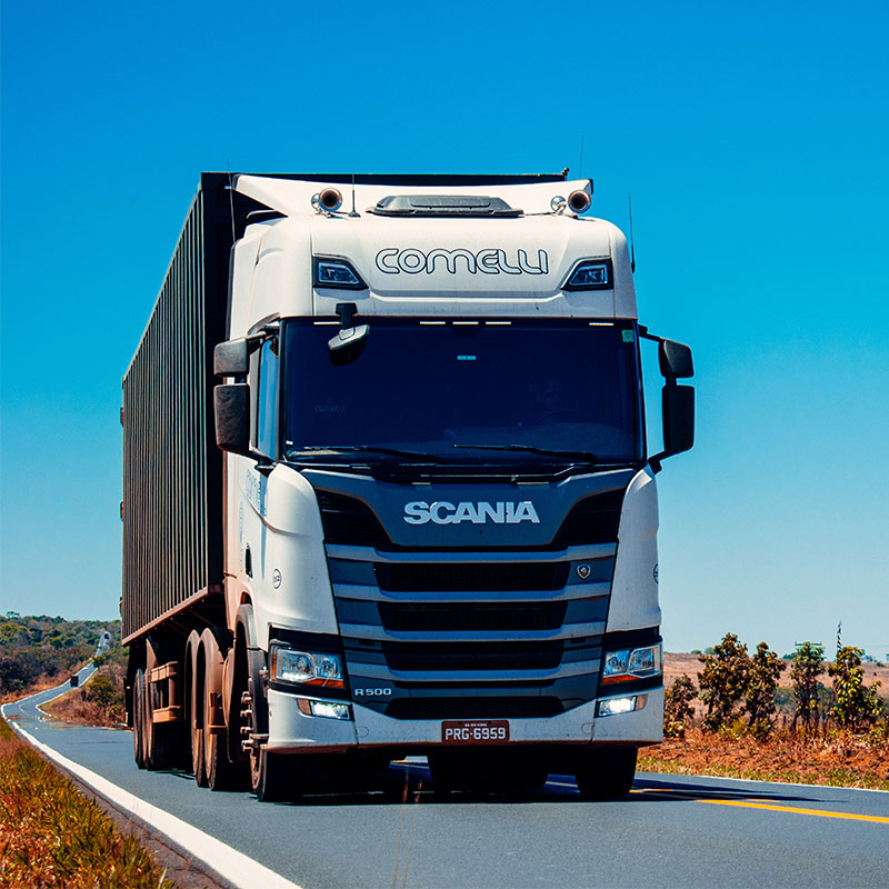 Why do large transport fleets use cargo monitoring technology?
