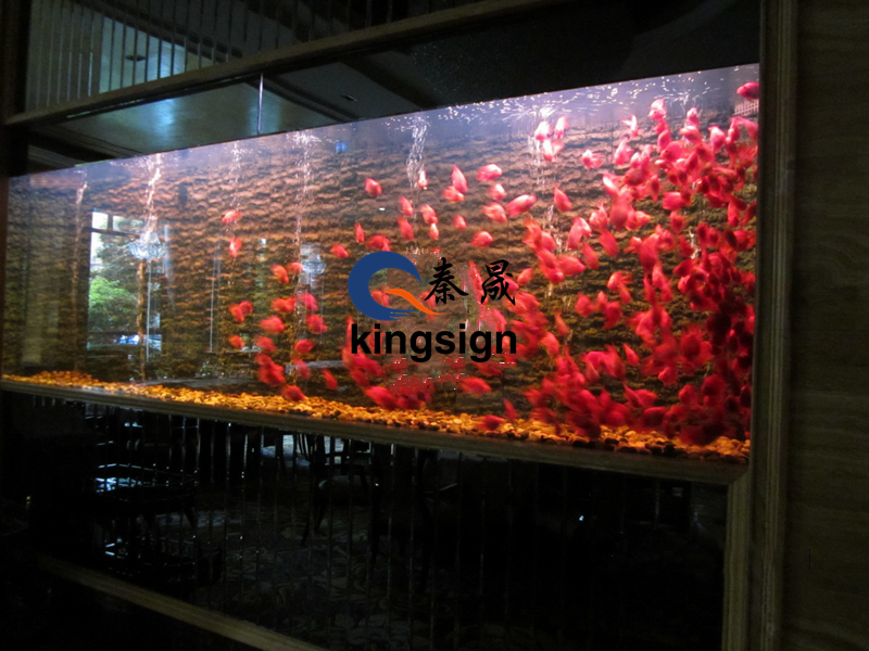 Why is it recommended to use acrylic material for large-scale fortune fish tanks?