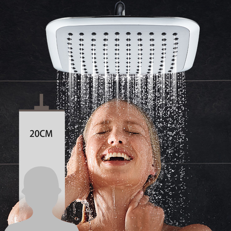 How should you remove scale from the shower head?