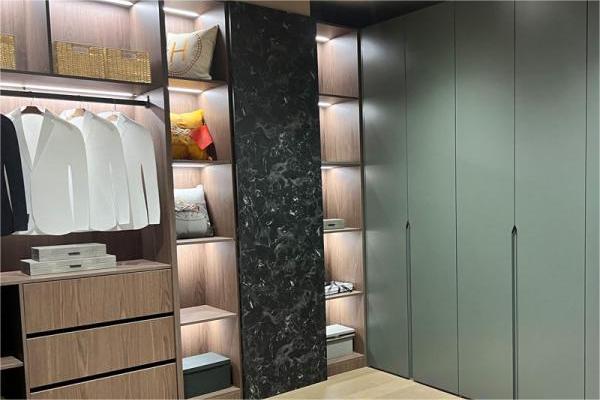 What is the depth of the wardrobe cabinet in the bedroom?