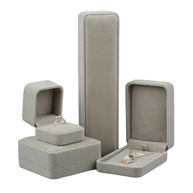Boîte à bijoux en velours de conception moderne de couleur grise pour collier de boucles d'oreilles