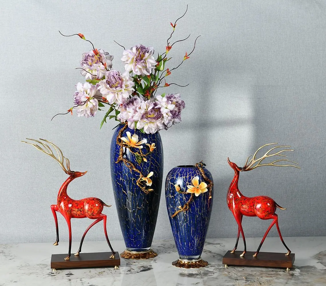 Paired Bronze Deer and Crystal-Clear Glass Vases