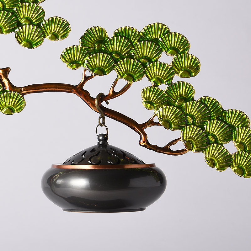 Zen-inspired incense burner greeting pine with enamel craft and a marble base