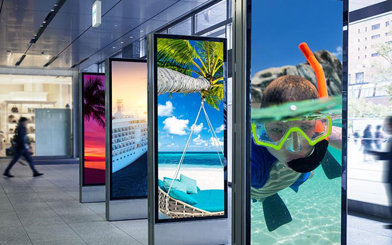 What protective measures should be taken for outdoor digital signage?