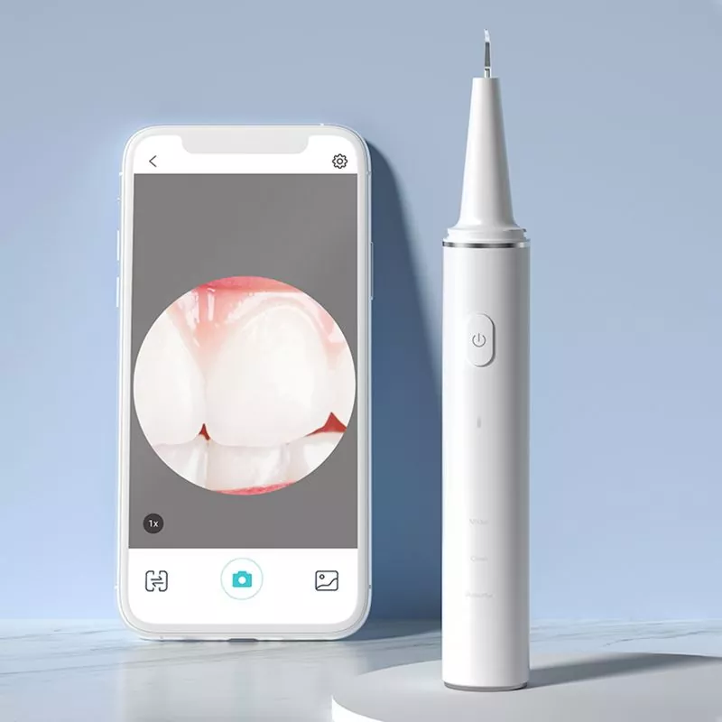 Sähköinen hampaiden puhdistusaine kameralla