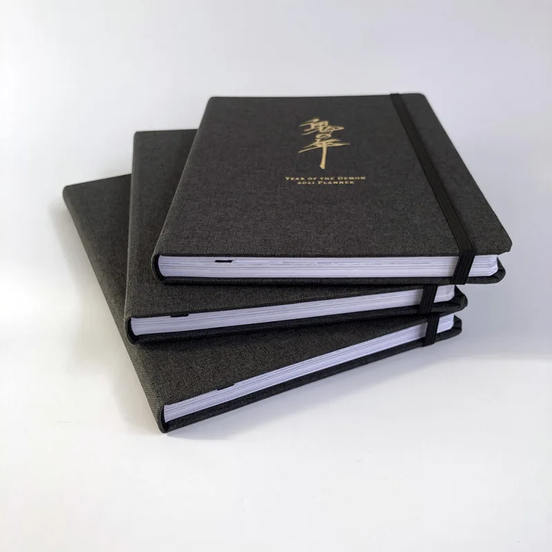 Impresión elástica del cuaderno de la cubierta del paño de Moleskin