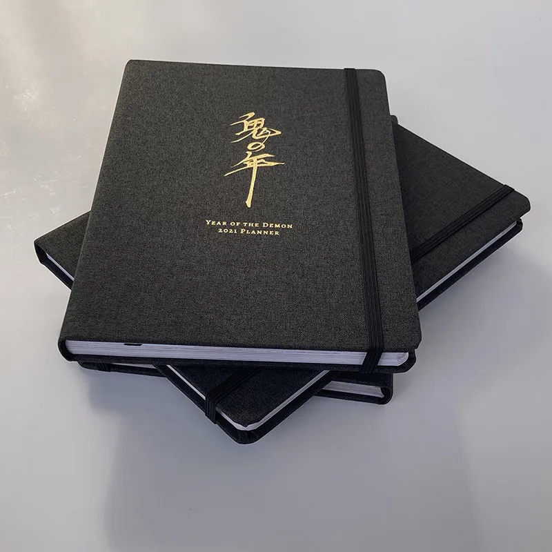 Impressão elástica do caderno da capa de pano de Moleskin