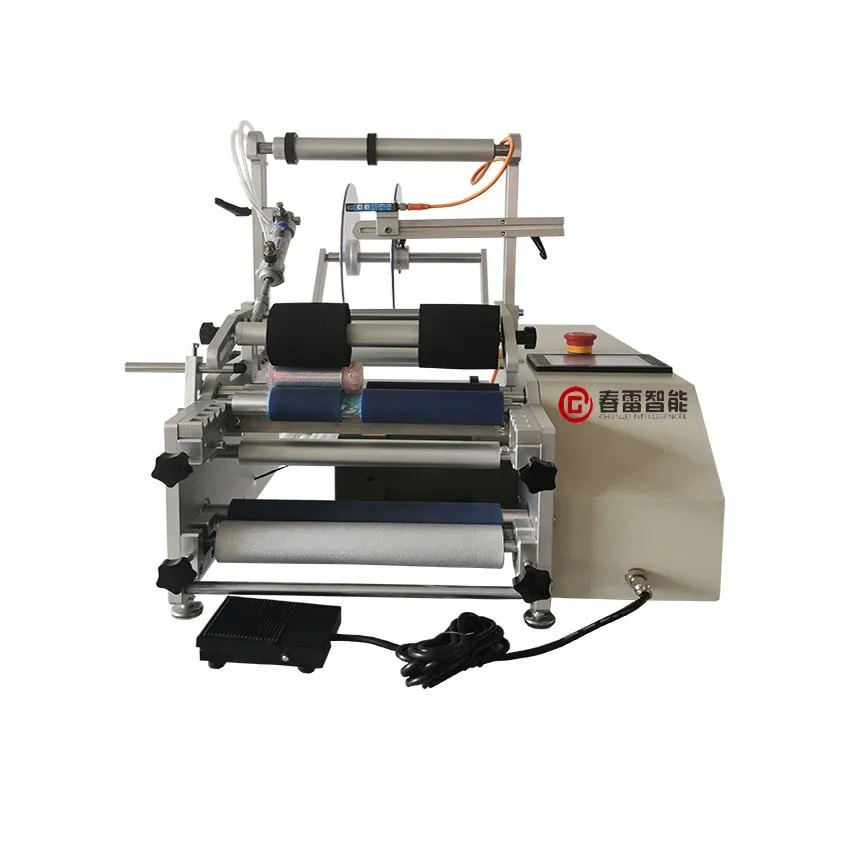 Semi - automatic double sided round bottle labeling machine