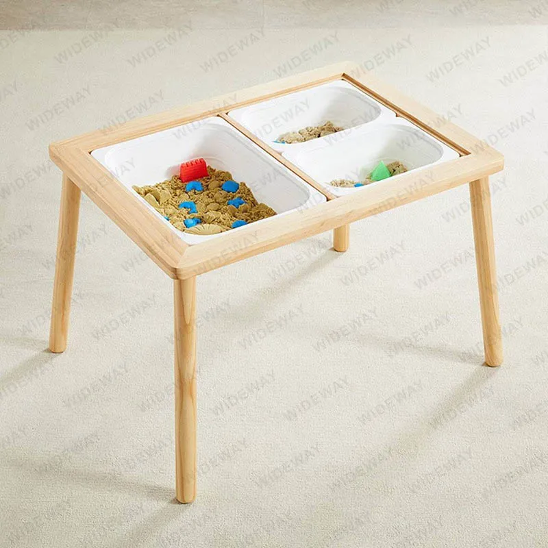 How can playing with a table sand box benefit a child's social skills?