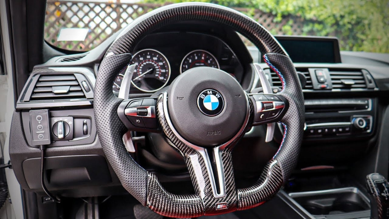 The BMW Carbon Steering Wheel combines modern design with lightweight materials for a sporty look.