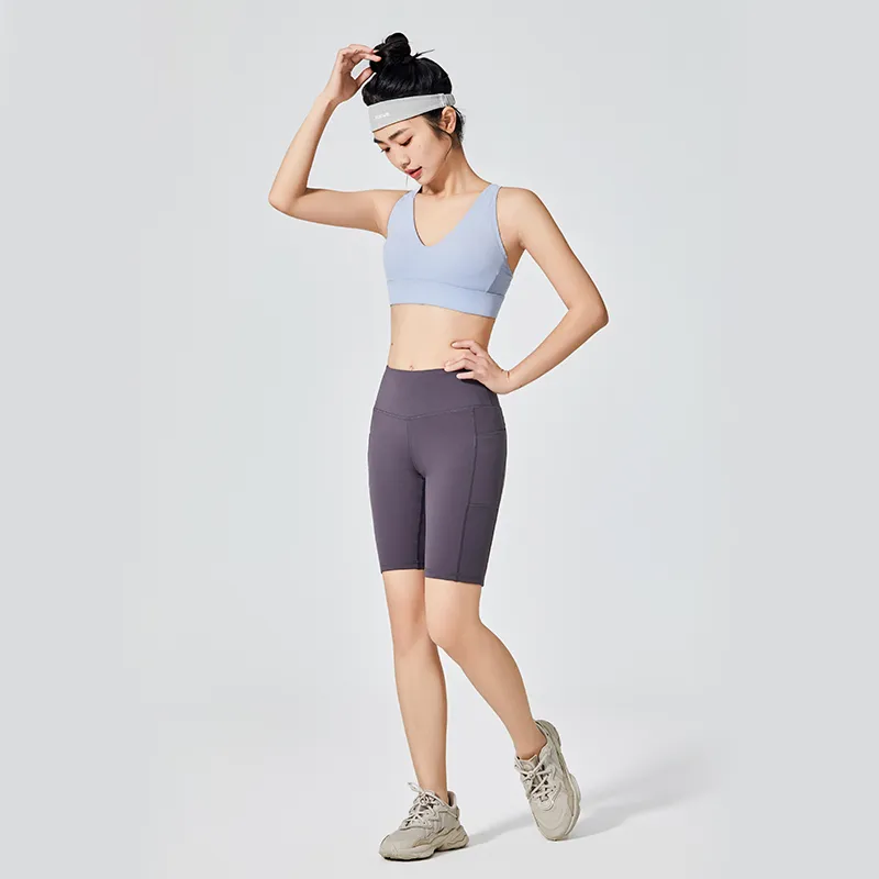 Pantalones cortos deportivos de longitud media para bicicleta para mujer con bolsillos