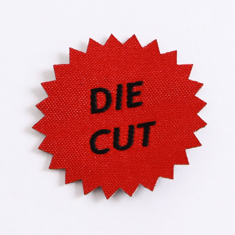 ຜົນປະໂຫຍດຂອງການໃຊ້ Die Cut Woven Labels ໃນຄົນອັບເດດ: ແລະຜະລິດຕະພັນສິ່ງທໍ