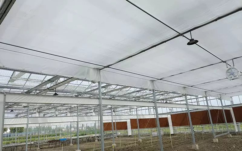 What are the different materials used in greenhouse inside screen systems?