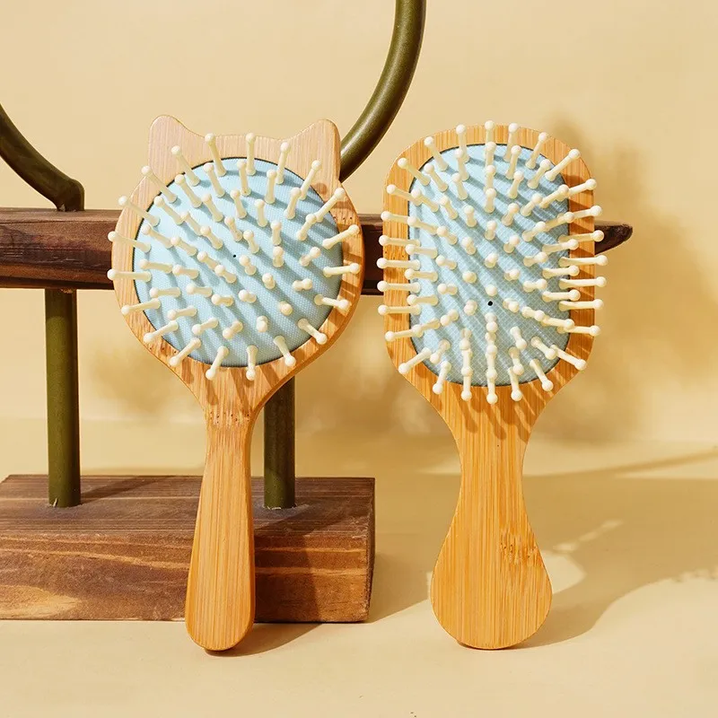 Mini spazzola per capelli da massaggio